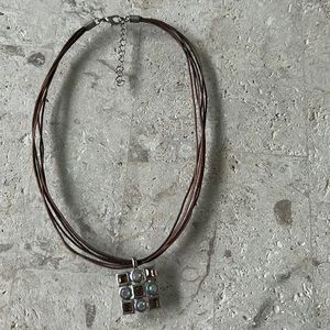 Multi string necklace with square pendant
